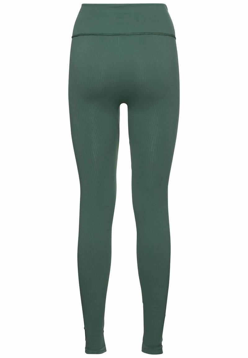 Grüne Leggings mit einer glatten, dehnbaren Textur, hohem Taillenbund und enganliegendem Design. Verfügt über feine Rippungen im Stoff.