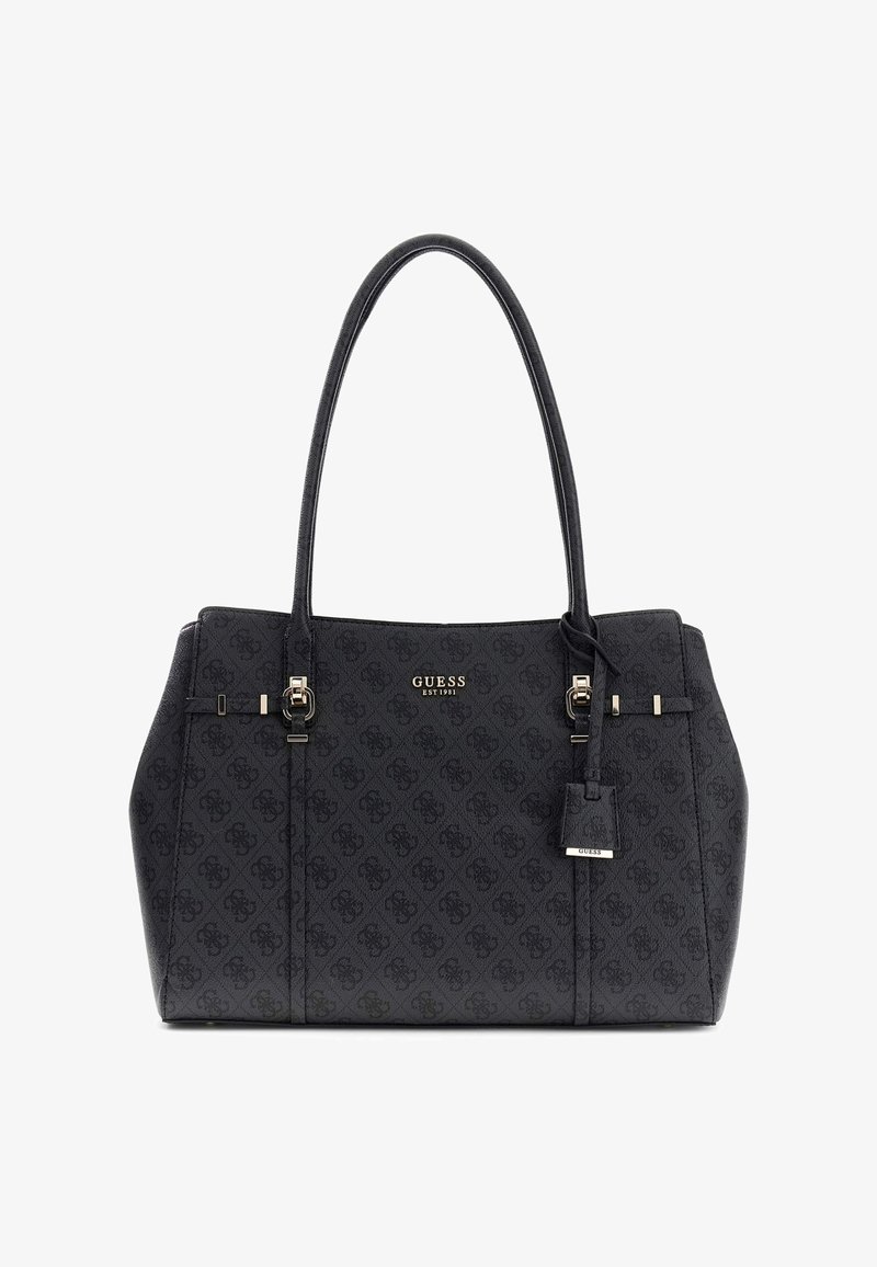 Sac à main noir Guess avec double poignée, plaque logo ton or, motif subtil et petite étiquette suspendue sur fond blanc.
