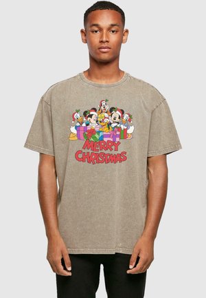 Brown cotton t-shirt featuring a festive graphic of cartoon characters and "MERRY CHRISTMAS" in red text, round neckline, relaxed fit.