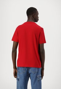 Tommy Hilfiger STACK - Print T-shirt - medium red