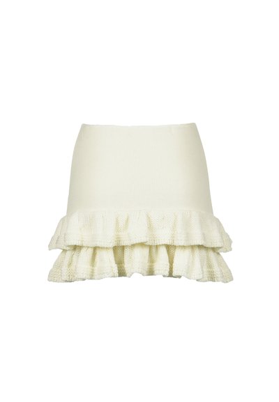 Valkoinen neulottu hame, jossa on istuva yläosa ja levenevä, röyhelöinen helma, jossa on teksturoidun kuvio ja pehmeä viimeistely.