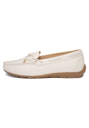 White leather loafer with beige rubber sole, moccasin stitching, and decorative bow on top, shown from the side.