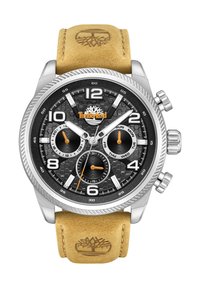 Orologio cronografo con quadrante esagonale nero, cassa in metallo argento, indicatori rotondi, accenti arancioni e un cinturino in pelle beige con logo.