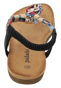Black and multi-colored flat sandal with braided strap, gold hardware accents, cushioned tan footbed, and textured rubber sole.