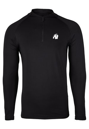 Zwarte long-sleeve shirt met een kwart-rits kraag en een klein wit gorilla-logo op de borst, gemaakt van een glad, rekbaar materiaal.