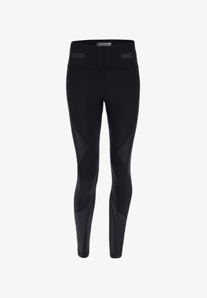 Leggings atléticos negros hechos de tela elástica, con una cinturilla alta, acentos de costura y diferentes texturas en los paneles.