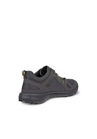 Sportliche Schuhe aus dunkelgrauem Mesh mit gelben Akzenten, abgerundeter Form, strukturiertem Sohlenprofil und Schnürung vorne. Mit Polsterung am Kragen.