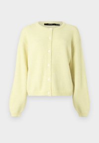 Kollane pehme kardigan, millel on ümmargune kaelus, pikad varrukad ja esiküljel viie ümmarguse valge nupuga sulgur.