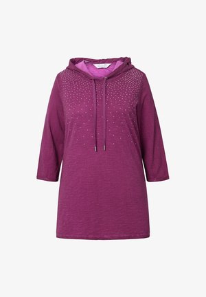 Sweat à capuche violet avec des manches trois-quarts, présentant un design texturé, des embellissements et une couleur de doublure de capuche contrastante.