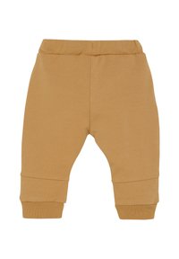 Mosterdkleurige kindertrainingsbroeken van zachte stof, met een elastische tailleband en geribde enkels, met een eenvoudig, glad ontwerp.