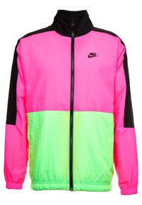Klart rosa och neongrön Nike vindjacka med svarta detaljer, hel dragkedja framtill och elastiska ärmslut.