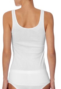 White tank top with a scoop back design, made from a smooth cotton blend fabric, featuring thin shoulder straps and a fitted silhouette.
