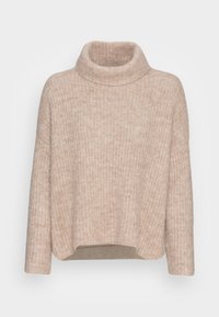 Maglione beige a collo alto con un pattern di maglia testurizzato, di lunghezza cropped e silhouette ampia. Tessuto morbido con dettagli a coste sul collo.