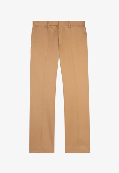 Beżowe spodnie materiałowe, wykonane z gładkiego materiału, z płaskim przodem, dwoma bocznymi kieszeniami i prostymi nogawkami o czystym wykończeniu.
