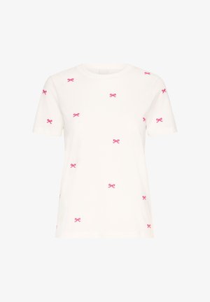 Biela tričko s krátkym rukávom s výšivkou ružovej mašle roztrúsenou po látke. Vyrobené z mäkkej bavlny s klasickým okrúhlym výstrihom.