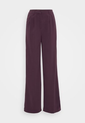 Wide-leg trousers in deep purple fabric. Features a tailored waistband with pleats. Smooth texture with no visible patterns or hardware.