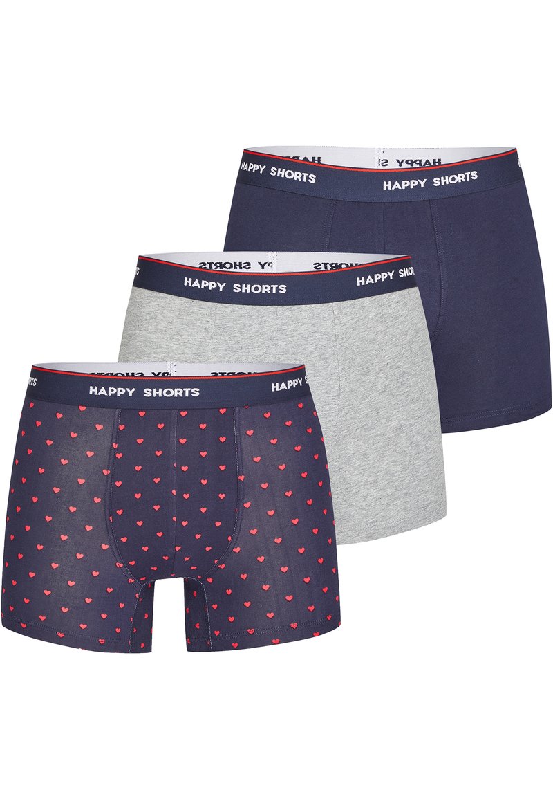 Tre paia di boxer da uomo: uno con uno sfondo blu navy e un motivo a cuori rossi, uno blu navy uniforme e uno grigio melange, tutti con cinturini elastici.