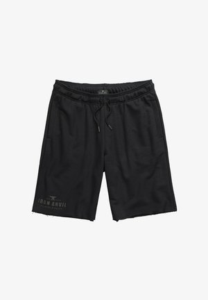 Czarne spodenki sportowe z elastycznym paskiem i sznurkiem, z kieszeniami bocznymi oraz postrzępionym dołem z logo nadrukowanym na jednej nodze.