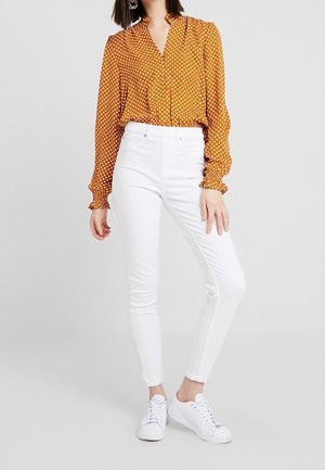 Farkkuleggingsit - white