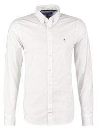 Wit overhemd met lange mouwen en knopen, voorzien van een klassieke kraag. Heeft een klein logo op de linkerborst en een gladde, frisse stoftextuur.