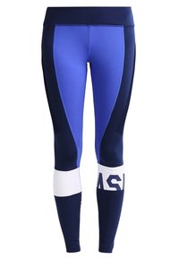 Niebiansko-granatowe elastyczne legginsy z wysokim stanem, bocznymi panelami oraz białym akcentem z czarnym napisem w dolnej części nogawki.