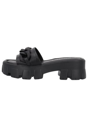 Black slide sandal with a chunky sole. Features a woven strap design and smooth texture. Platform base provides added height and stability.