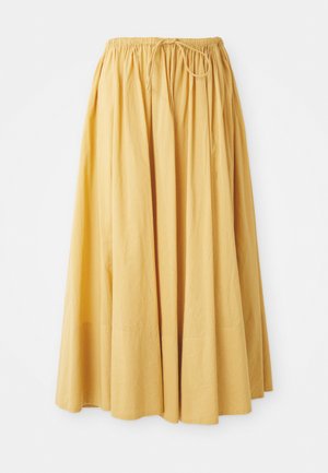 Long yellow skirt with an elastic waistband and drawstring. Made of lightweight fabric, featuring gathered pleats for a flowy design.