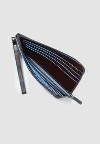 Brown leather wallet with blue interior lining, zip closure, multiple card slots, and a wrist strap. Smooth texture and sleek design.