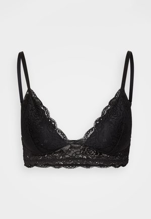 Zwarte kanten bralette met driehoekige cups, verstelbare bandjes en een gegolfde rand. Zachte stof met fleurige details aan de band.