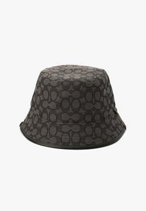 Chapeau de seau noir en tissu texturé avec un motif circulaire répété. Il possède un bord flexible et une bordure cousue pour plus de durabilité.