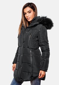 Black padded coat featuring a zip-up front, side pockets, and a removable fur-lined hood. Textured surface with vertical stitching accents.