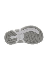 Semelle de chaussure en caoutchouc gris présentant des motifs texturés, les mots "SMART" et "FLEX ZONE," ainsi qu'un logo circulaire avec "chicco."