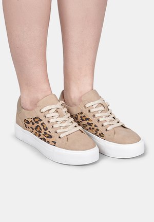 Beige sneakers with leopard print side panels, smooth texture, round toe, white rubber sole, and flat laces.