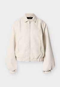 Jachetă crem cu fermoar, cu guler de cămașă, mâneci lungi bufante și tiv elastic, pe un fundal simplu.