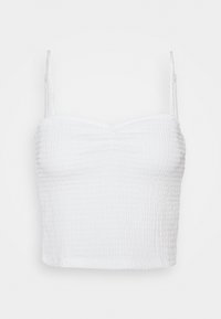 Top blanc court avec bretelles spaghetti réglables, présentant un motif texturé plissé et un décolleté légèrement froncé.