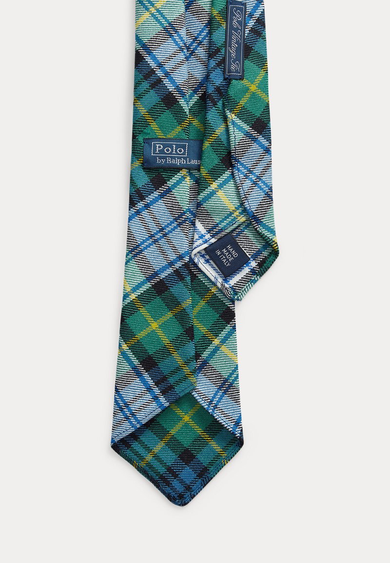 Plaid tie in green, blue, and yellow with black accents; features a silk texture, pointed tip, and branded labels. Handcrafted in Italy.
