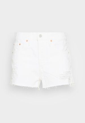 Vita denimshorts med fransar i nederkanten, med slitna lappar och kopparfärgade detaljer. Inkluderar framfickor och en knappstängning.