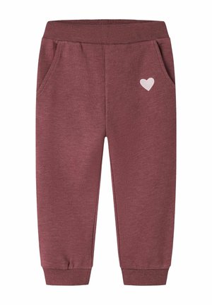 Pantalon de jogging doux bordeaux pour tout-petits avec taille élastique, chevilles resserrées, poches latérales et petit détail cœur blanc sur le côté droit.