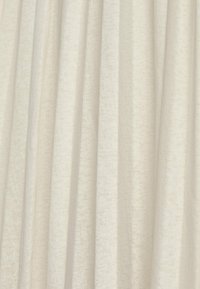 White textured fabric with vertical pleats, featuring a soft, lightweight material and a subtle pattern, suggesting a delicate finish.