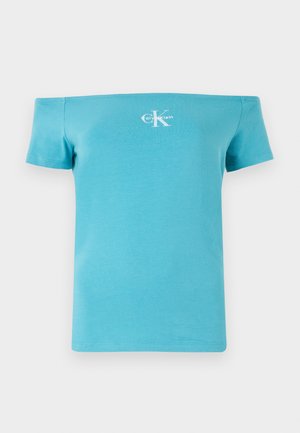 T-shirt turquoise décolleté en coton doux, avec des manches courtes et un logo graphique blanc sur le devant.