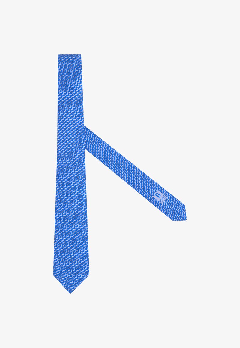 Cravate bleue avec un motif répétitif de petits flamants roses blancs et une étiquette visible sous la pointe.