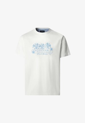 Camiseta blanca de manga corta con gráfico de palmera azul y texto "FAÇONNABLE NICE-CÔTE D'AZUR Riviera Francesa" en el frente.
