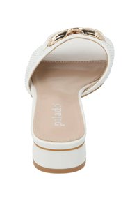 White slide sandal with a textured upper, gold accent hardware, and a cushioned beige insole. Features a rounded toe and a low block heel.