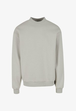 Sweatshirt gris clair avec un col haut, des manches longues et des poignets et un ourlet côtelés. Fabriqué à partir d'un tissu doux et texturé.