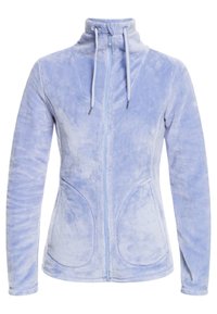 Vaaleansininen fleece-takki korkealla kauluksessa, etuvetoketjulla ja kahdella sivutaskulla. Varustettu kiristyshoidoilla ja tikatulla yksityiskohdalla.