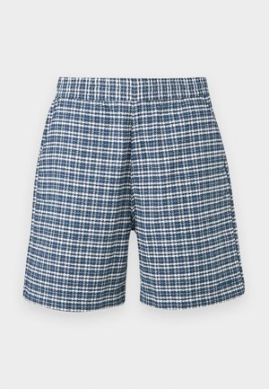 Shorts à carreaux bleus et blancs avec une taille élastique et une coupe droite, présentés sur un fond uni.