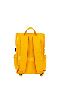 Yellow backpack featuring padded shoulder straps, fabric material, rectangular shape, two side pockets, and top handle for easy carrying.