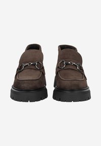 Brown suede loafers with a chunky black sole, featuring a decorative silver chain detail across the front and a rounded toe design.