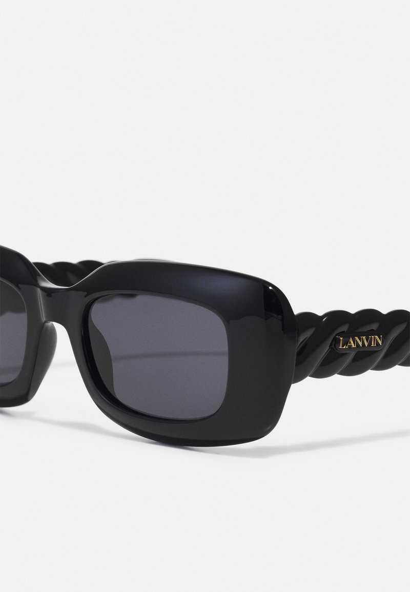 Black sunglasses with thick square frames and dark lenses. The temples feature a twisted design with a gold "LANVIN" logo accent.