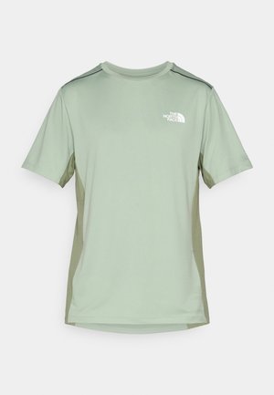 Short-sleeve athletic shirt in light green with darker green side panels. Features a round neck and a logo on the upper left chest.